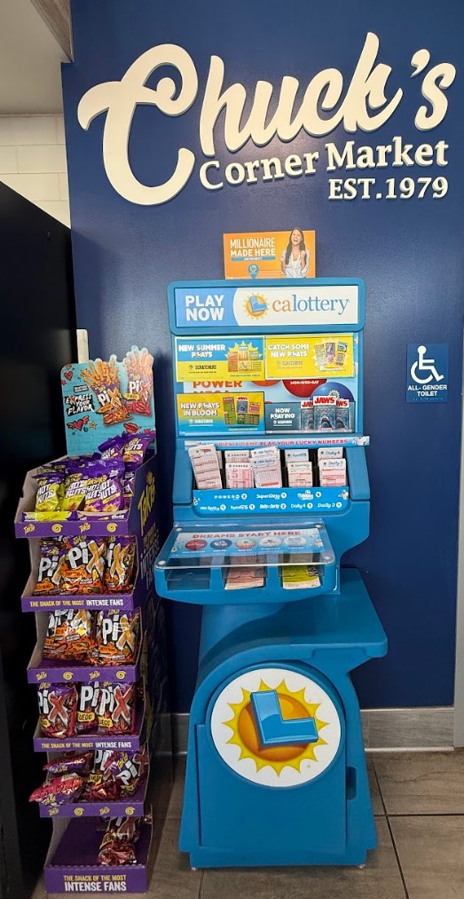 Inside Chuck's — deli counter and California Lottery station